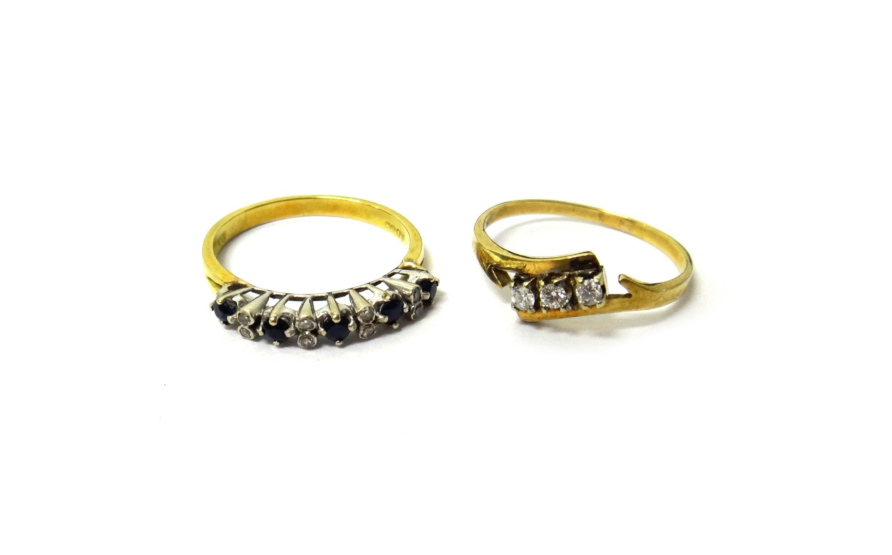 Appraisal: A gold and diamond set three stone ring claw set