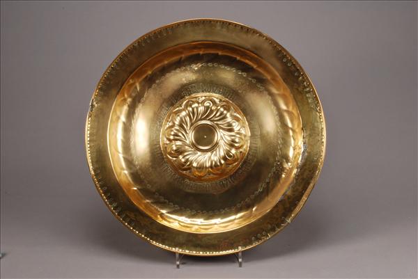 Appraisal: A Nuremberg brass alms dish late th century the raised