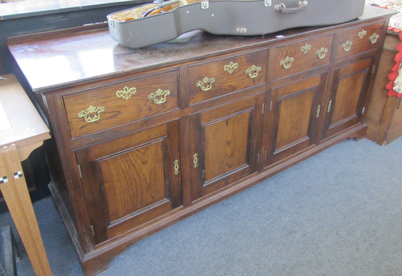 Appraisal: An th century style oak dresser base with four drawers