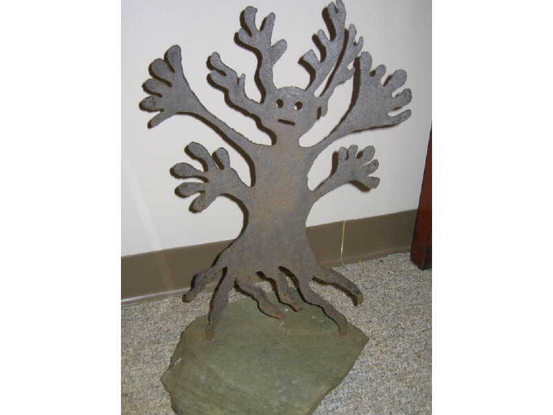 Appraisal: CUT IRON SCULPTURE depicting a tree-form figure raised on stone