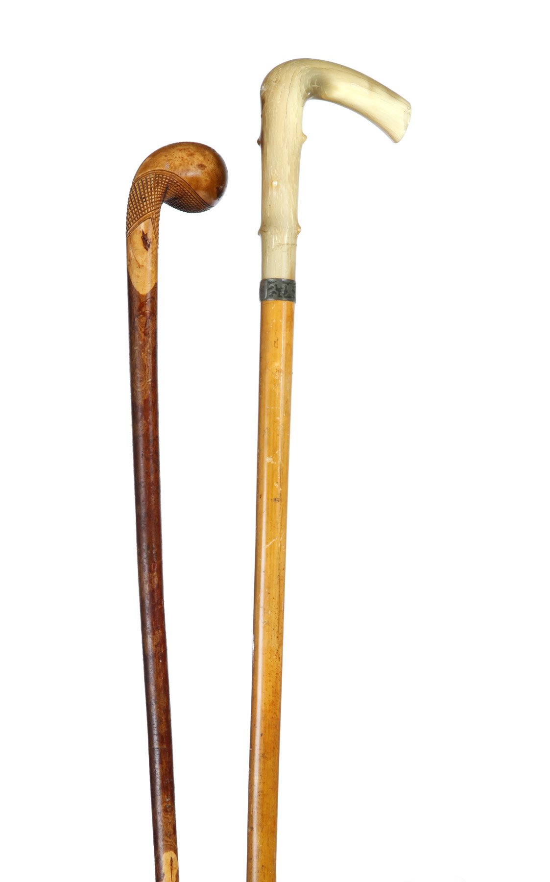 Appraisal: TWO WALKING STICKS American late th century Applewood with carved