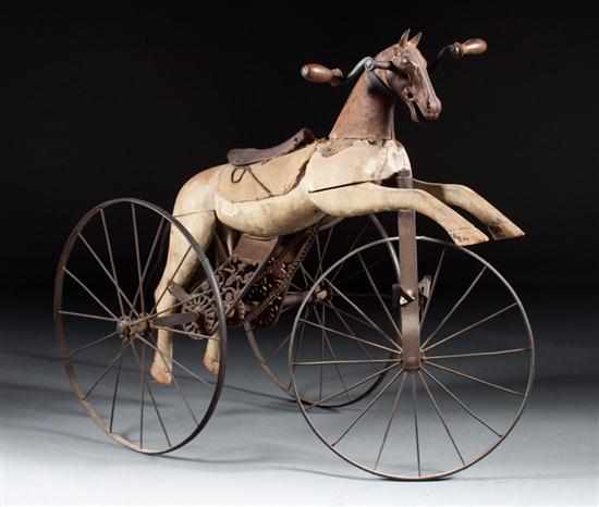 Appraisal: Victorian carved wood and wrought iron horse velocipede fourth quarter-