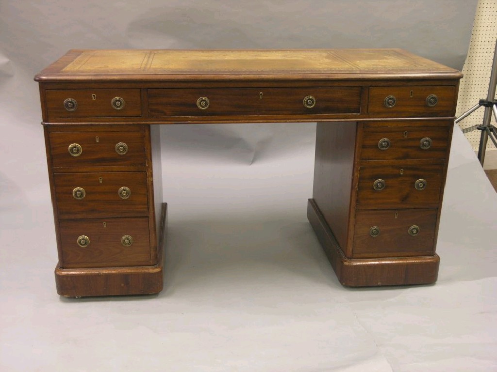 Appraisal: A Victorian mahogany pedestal desk inset gilt-tooled leather top above