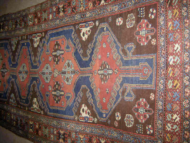 Appraisal: BAKHITARI LONG RUG The navy blue field centers a row