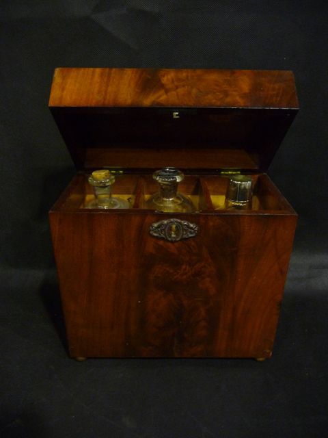 Appraisal: A th c mahogany decanter box containing three glass bottles