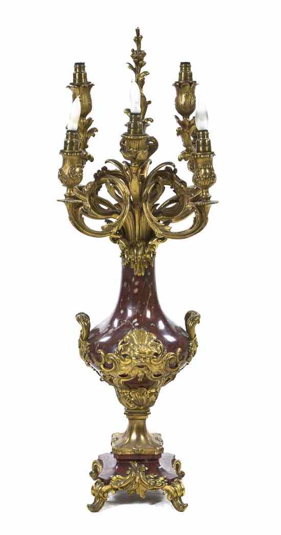 Appraisal: A Continental Gilt Bronze and Rouge Marble Eight-Light Candelabrum the