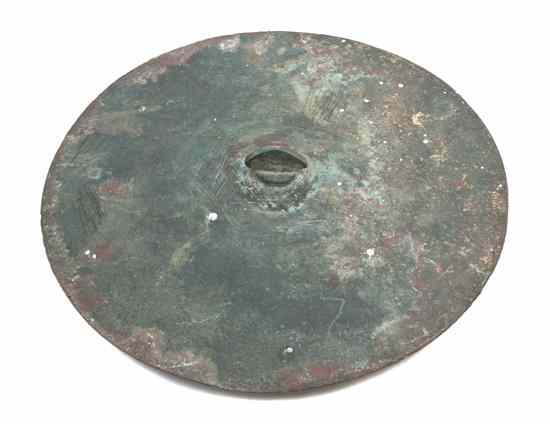 Appraisal: A Middle Eastern Bronze Article of circular form with a