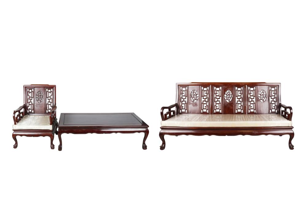 Appraisal: CHINESE CARVED HARDWOOD LIVING ROOM SUITEcomprising a settee with cream-colored