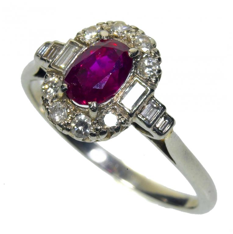 Appraisal: A RUBY AND DIAMOND CLUSTER RING with baguette diamond set