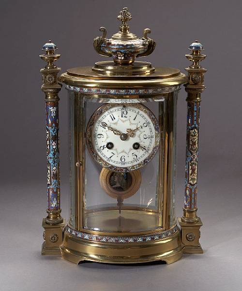 Appraisal: A French gilt bronze champlev enamel and glass mantle clock