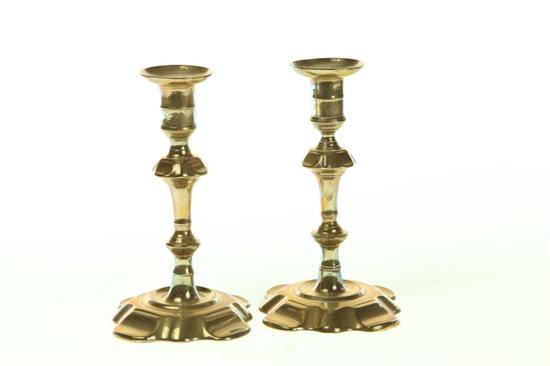 Appraisal: PAIR OF BRASS CANDLESTICKS England th century Petal bases seamed