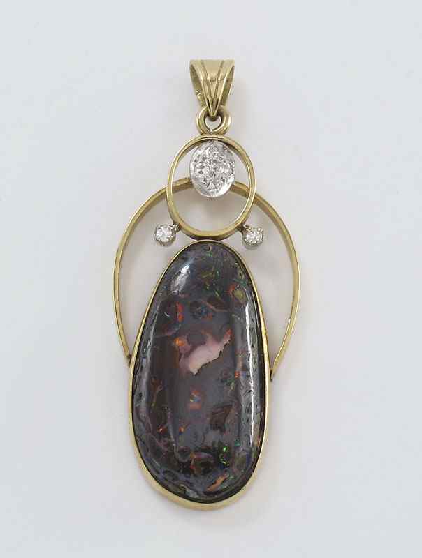 Appraisal: K DIAMOND BOULDER OPAL PENDANT K yellow gold pendant contains