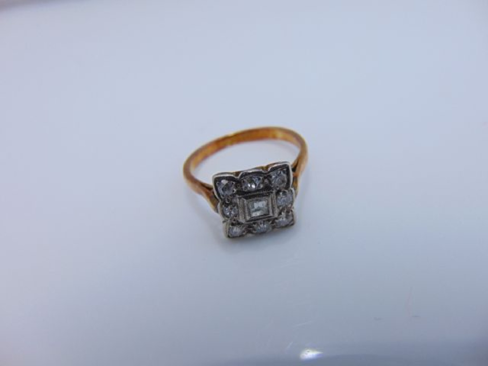 Appraisal: An Art Deco style diamond ring centred with a rectangular