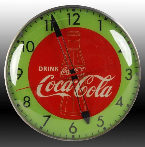 Appraisal: Coca-Cola Pam Electric Light-Up Clock Description Circa s Gold bottle