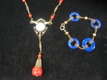 Appraisal: Red bead necklace and lapis link bracelet Red bead necklace