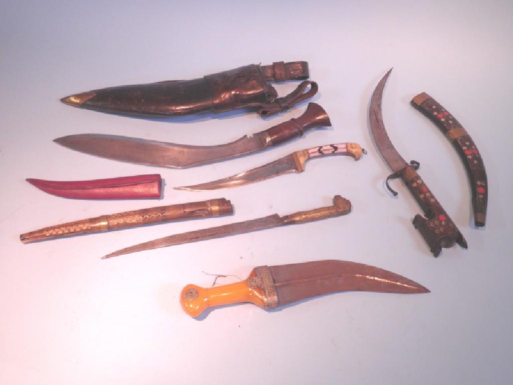 Appraisal: An Eastern dagger with a shaped blade an amber type