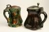 Appraisal: STEINS - Two th c pottery steins with pewter and