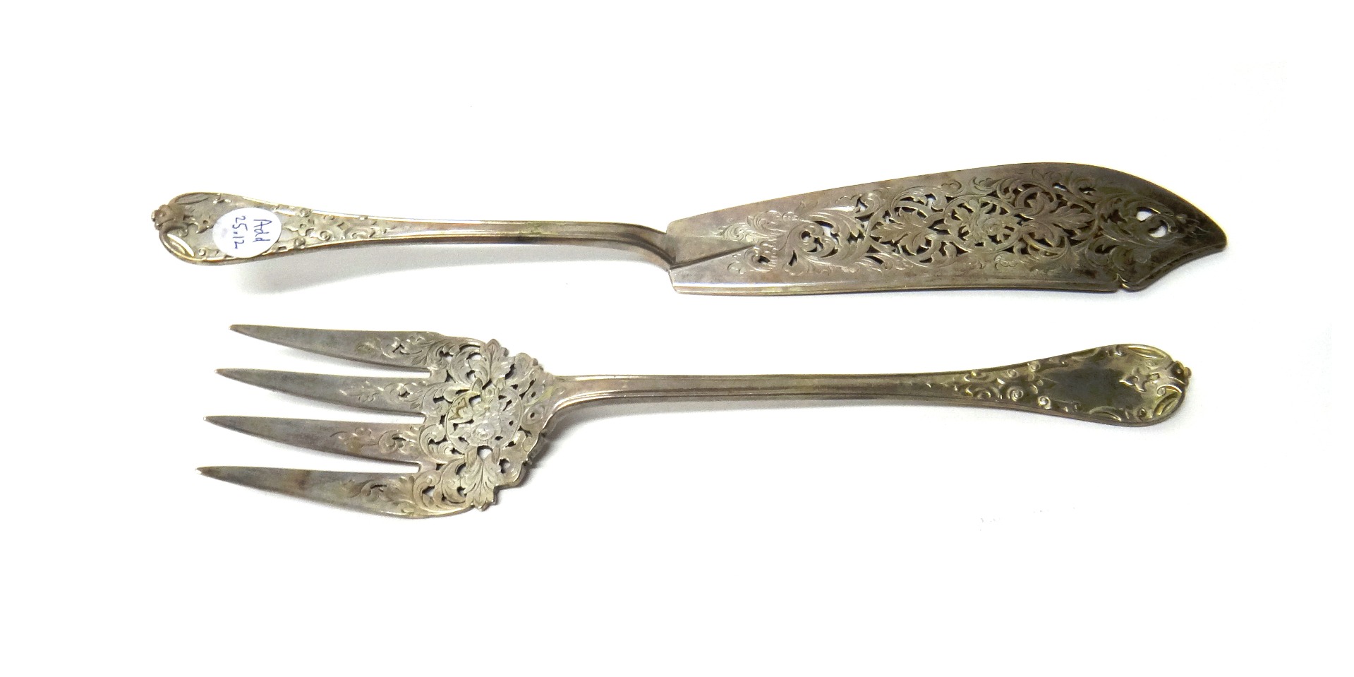 Appraisal: A pair of Victorian silver fish servers each with floral