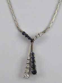 Appraisal: A hallmarked ct white gold sapphire and diamond negligee pendant