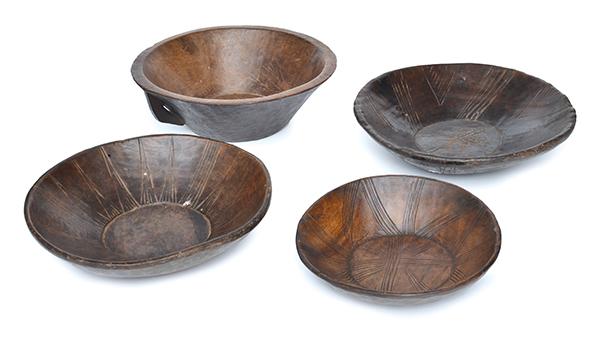 Appraisal: GROUP OF FOUR AFRICAN INCISED WOODEN BOWLS THE LARGEST CM