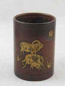 Appraisal: A Chinese bronze brush pot with inlaid brass animals and