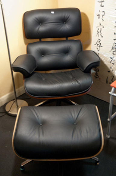 Appraisal: EAMES STYLE BLACK LEATHER LOUNGE CHAIR AND OTTOMAN