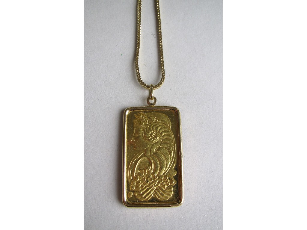 Appraisal: Fine gold pendant weighing ounce with embossed decoration of a