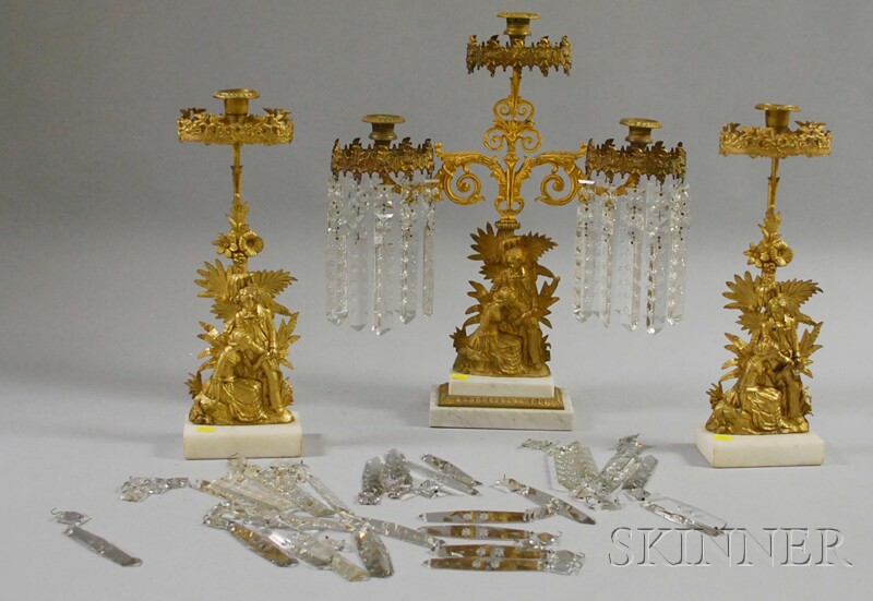 Appraisal: Three-piece Gilt-metal Figural Garniture Set with Prisms and marble bases