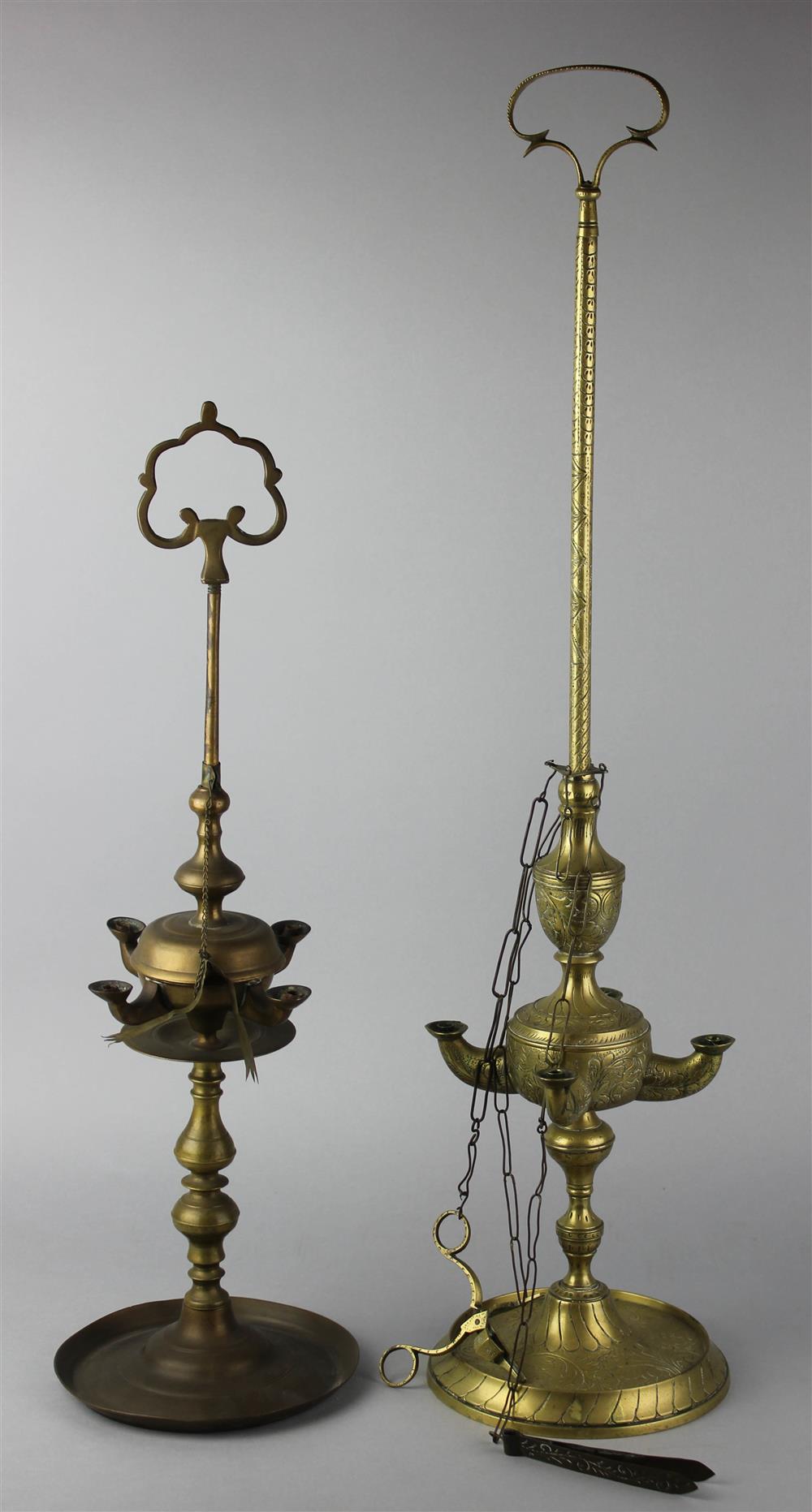 Appraisal: TWO NEAR EASTERN STYLE BRASS OIL LAMPS including one Continental