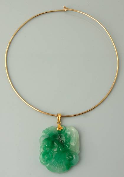 Appraisal: A carved jadeite pendant on a k gold collar wire