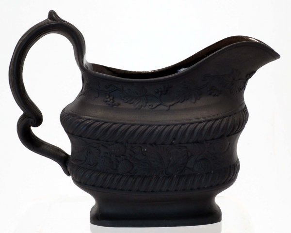 Appraisal: Black basalt creamer Matte exterior with twining strawberry vines between