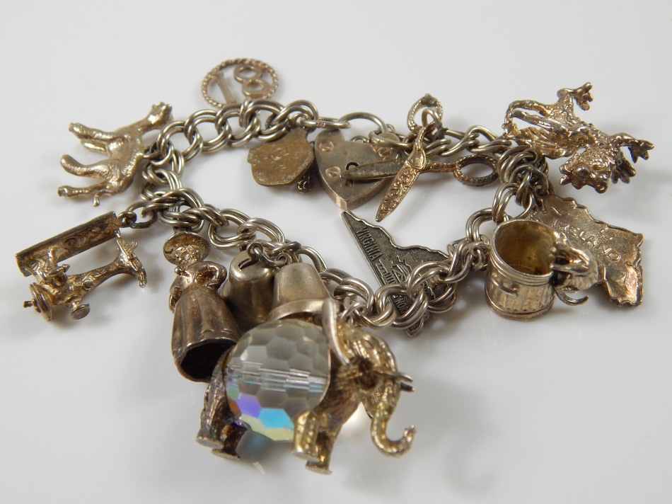 Appraisal: A silver charm bracelet and various silver and silver plated