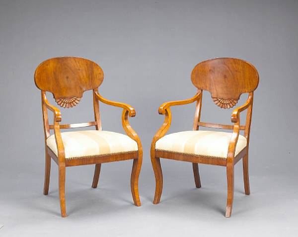 Appraisal: A pair of Swedish Neoclassical walnut and fruitwood armchairs early