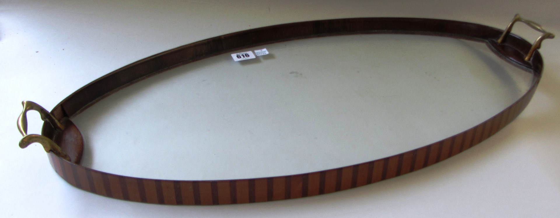 Appraisal: A th century inlaid mahogany glass bottom oval serving tray