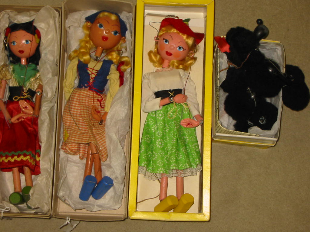 Appraisal: Four Pelham puppets S Mitzi yellow window box A Poodle