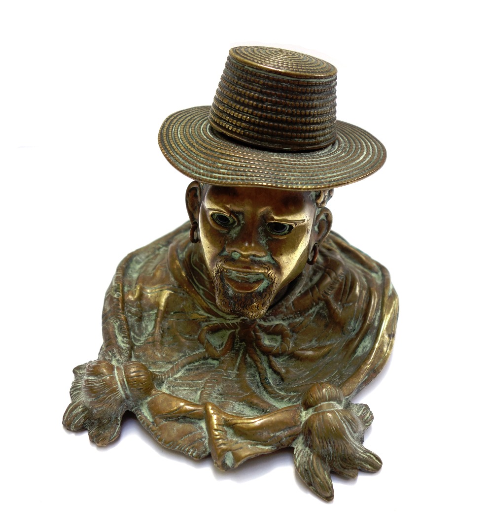 Appraisal: A Victorian brass novelty inkwell modelled and cast as the