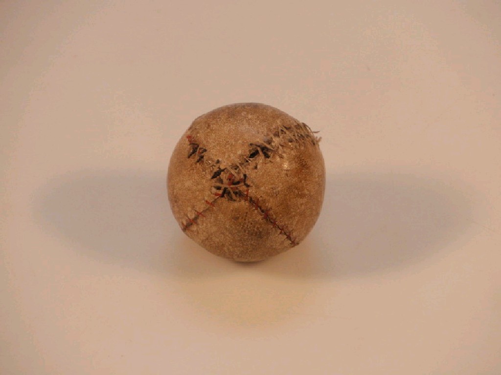 Appraisal: A leather covered golf ball