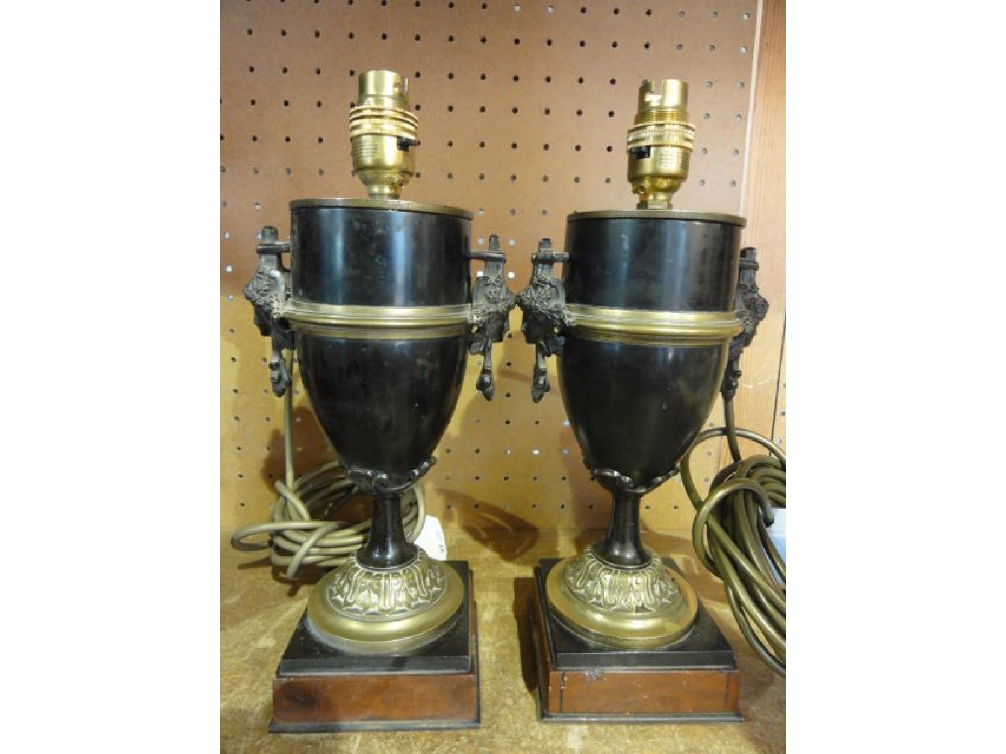 Appraisal: A pair of urn shaped desk lamps principally in polished