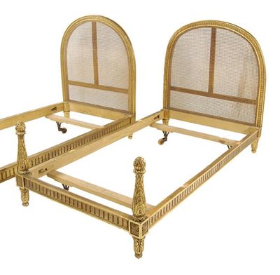 Appraisal: A pair of continental giltwood single bedsteads each with a