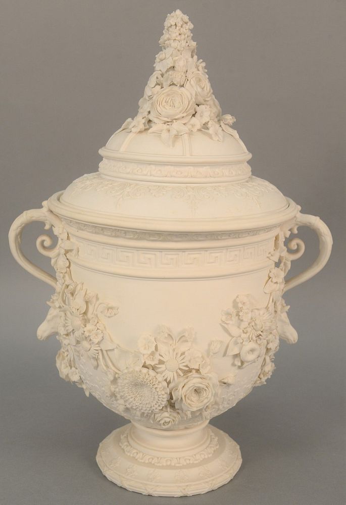 Appraisal: Large Bisque covered urn having two handles and molded flowers