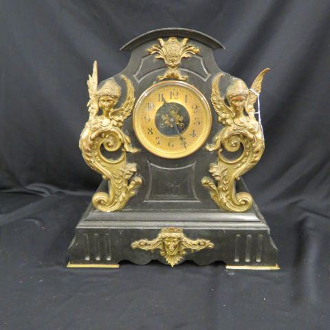 Appraisal: French Victorian Bronze Iron Mantle Clock gryphon face decor tall