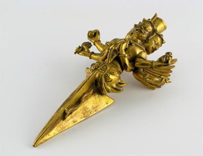 Appraisal: A South East Asian gilt bronze phurbu formed as a