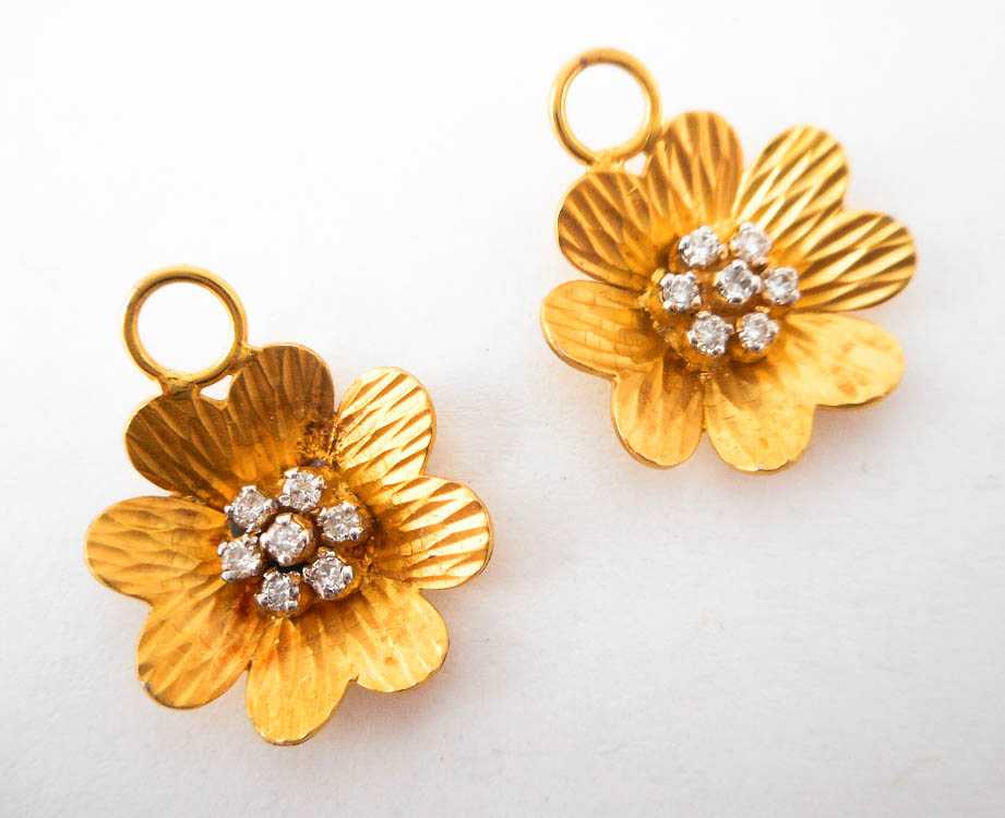 Appraisal: PAIR OF DIAMOND EARRING ENHANCERS each k yellow gold flower