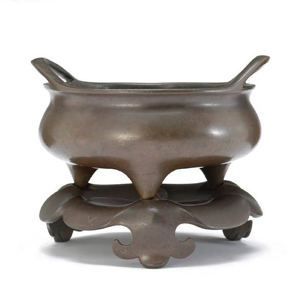 Appraisal: A cast bronze censer and stand Xuande Mark th Century