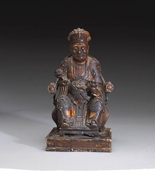 Appraisal: A carved and lacquered wood figure of Tudi Gong th