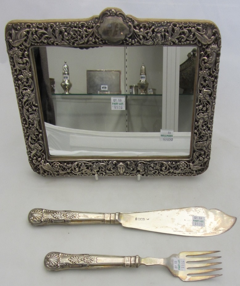 Appraisal: A Victorian silver mounted shaped rectangular mirror decorated and pierced