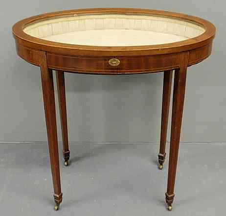 Appraisal: Oval mahogany curio table late th c with line inlay