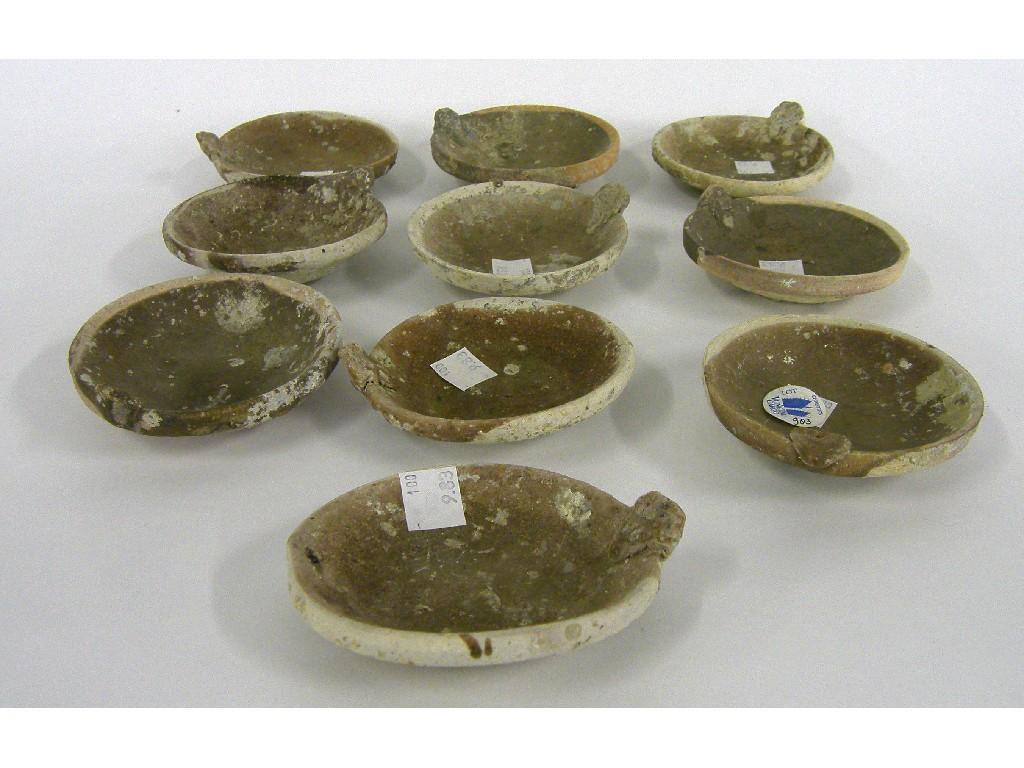 Appraisal: Ten Vung Tau Cargo unglazed pottery lamps with handles circa