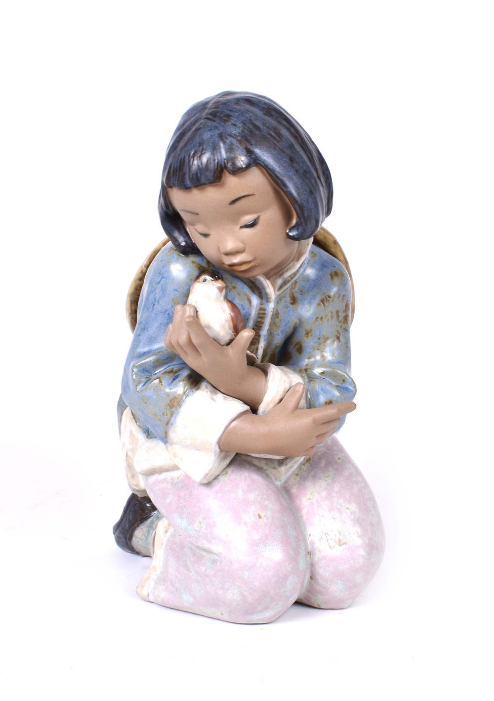 Appraisal: LLADRO ASIAN GIRL HOLDING A SPARROWThe underside marked number in