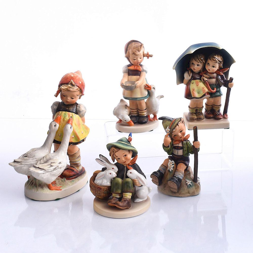 Appraisal: GOEBEL HUMMEL FIGURINES CHILDREN ANIMALS Bisque porcelain children modeled with